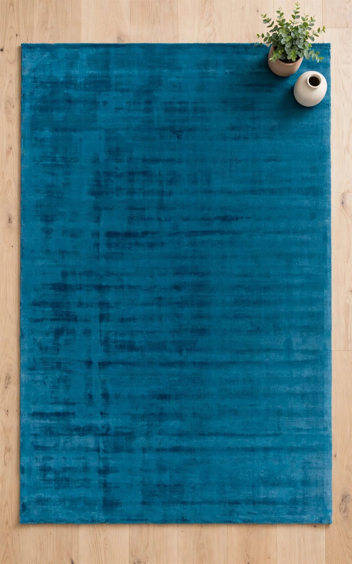 Blue Silky Viscose Rug, handmade in Bhadohi India – a rectangular blue area rug with a subtle distressed texture, laid flat on a
